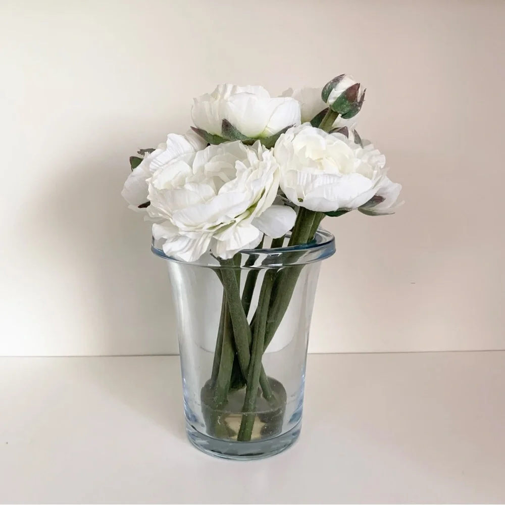 Thomas O’Brien Faux flowers in blue glass vase